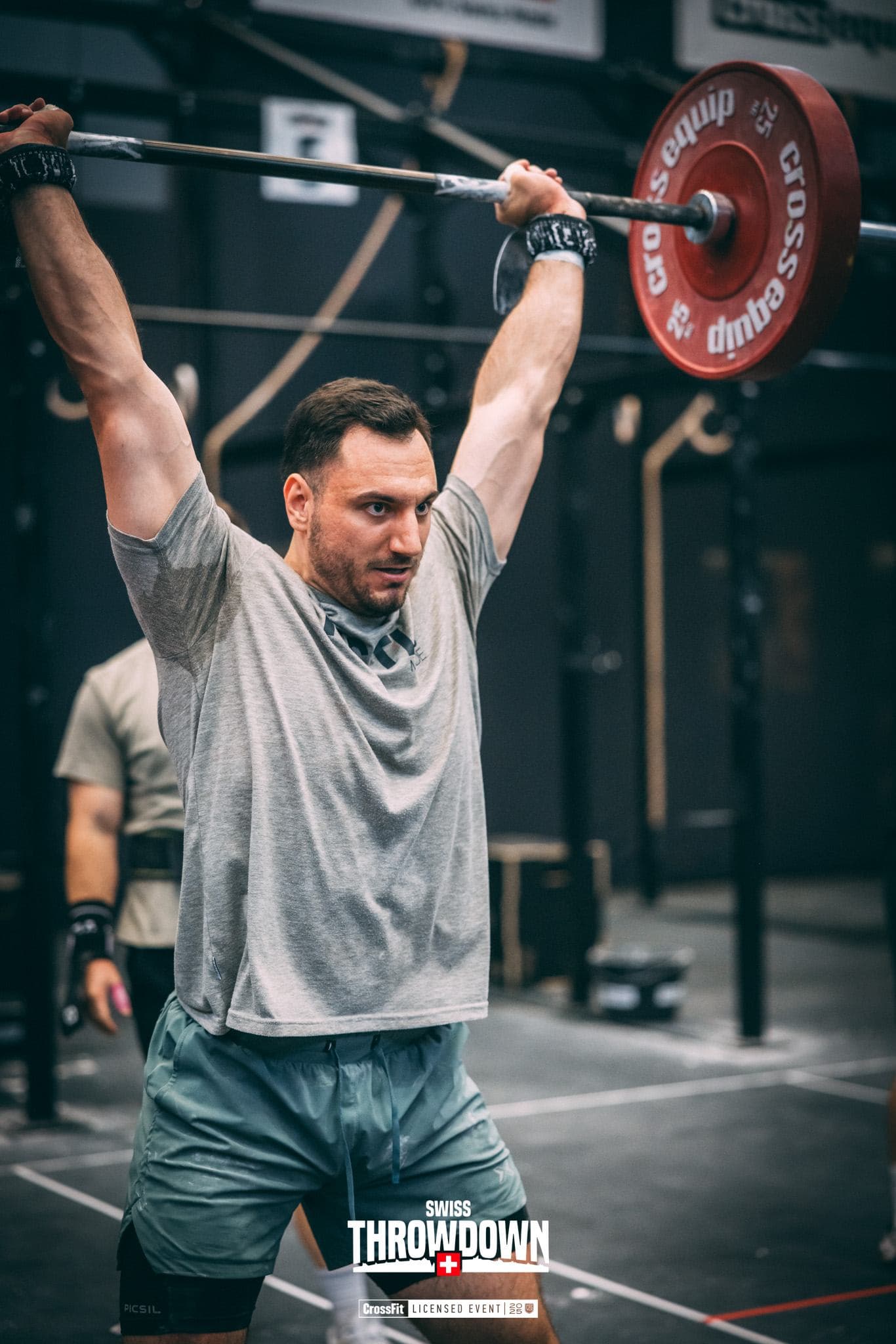 Roman Mathys locking out a barbell overhead