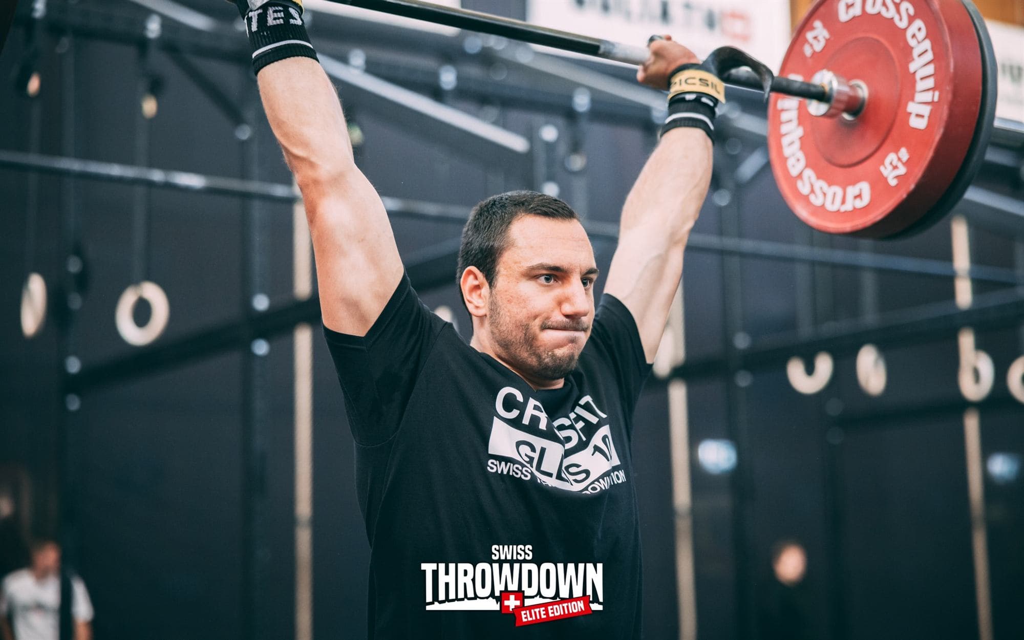 Roman Mathys pressing a barbell overhead at the Swiss Throwdown